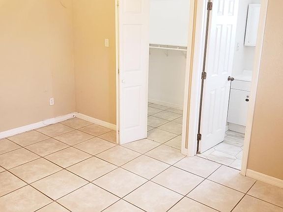 Walk-in closet with additional spacious hidden overhead storage