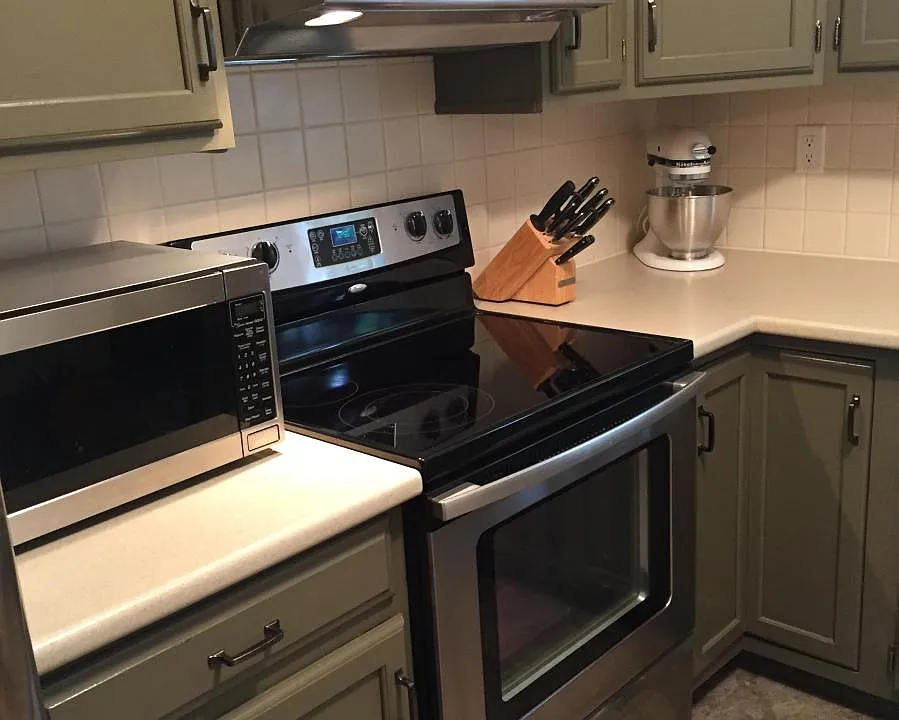 Stainless steel stove with glass cooktop