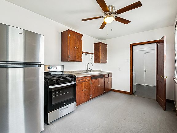 Kitchen with new stove & fridge