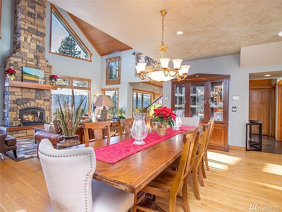 T&G ceilings in the living space, and custom paint over the dining area. Beautiful spot for a large table & dining set.