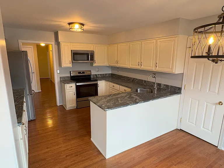 Kitchen / entrance to single car garage