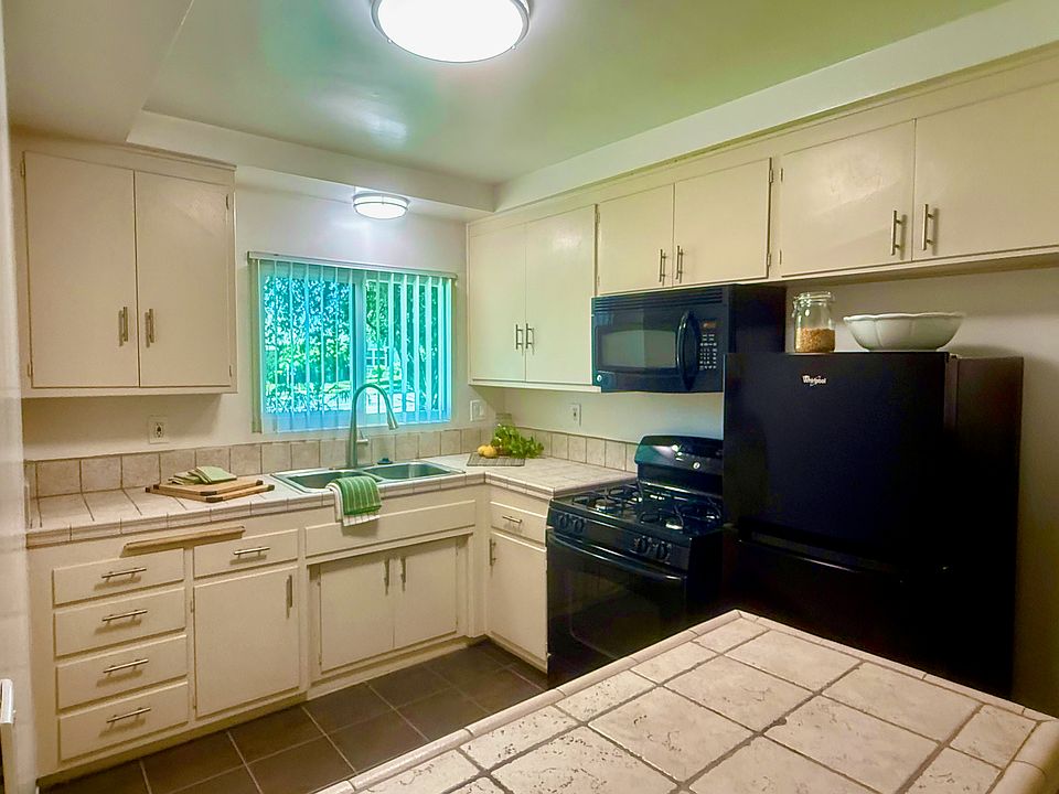 All new appliances with updated kitchen & Imported tile work. Coffered ceiling!
