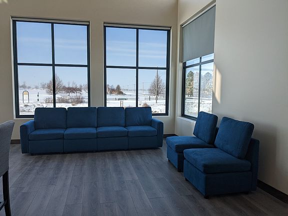 Spacious interior design allowing multiple seating and furniture layout. Sofa and loveseat, dining table, recliner, television, beds and bedding included.