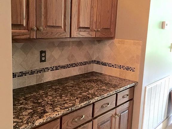 Granite  and tile backsplash