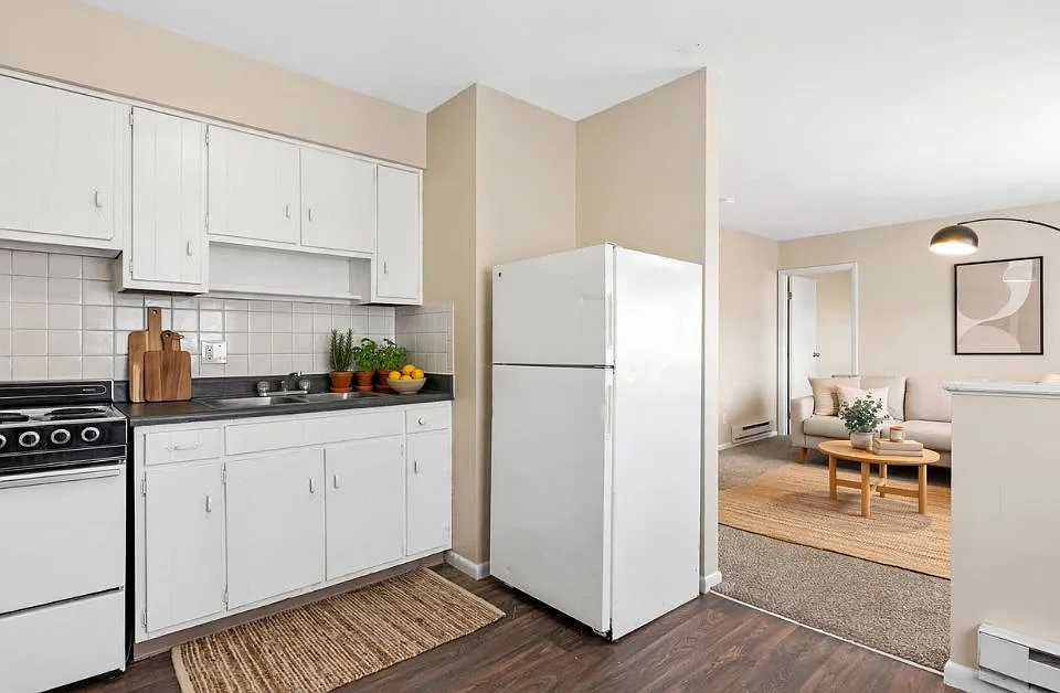 Kitchens feature new appliances, granite-like countertops, and maple cabinetry