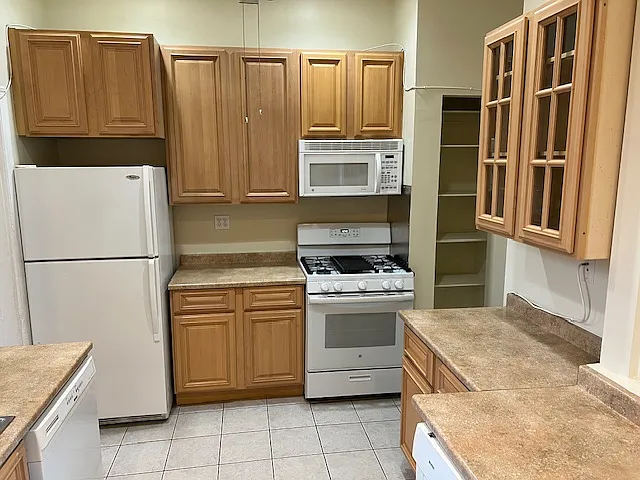 Kitchen: fridge, gas stove, microwave