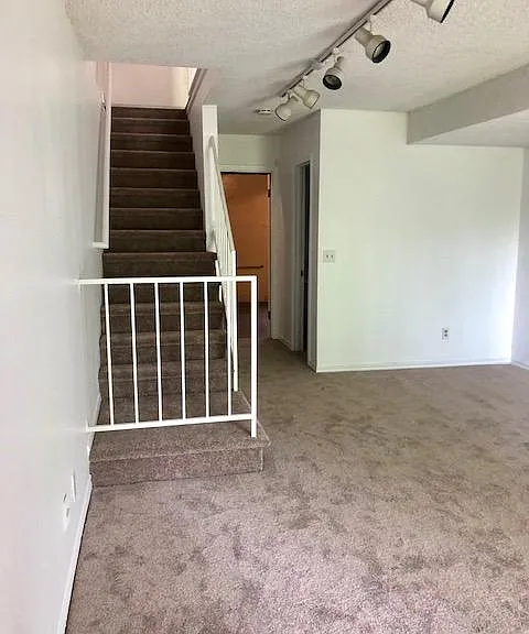 Lower level features a walk out basement, washer/dryer and 1/2 bath off of a bonus room