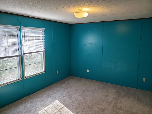 New carpeted master bedroom with walk in closet