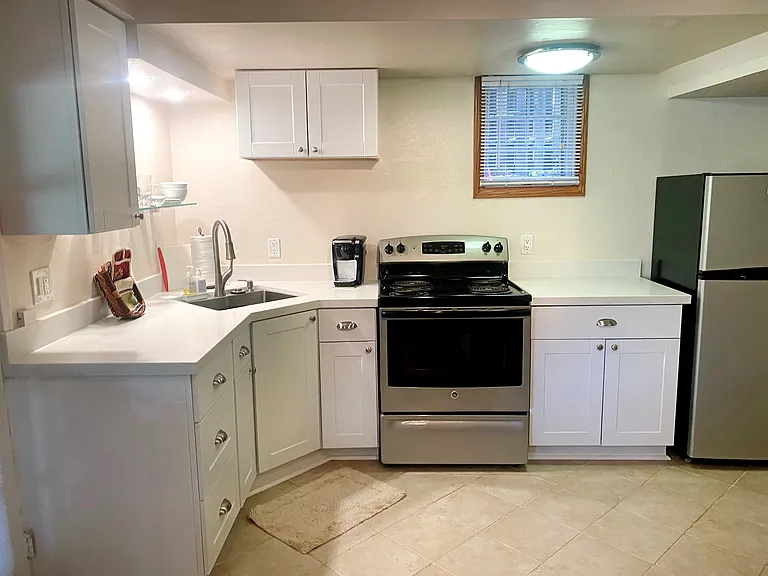 Newly renovated kitchen with updated stainless appliances.