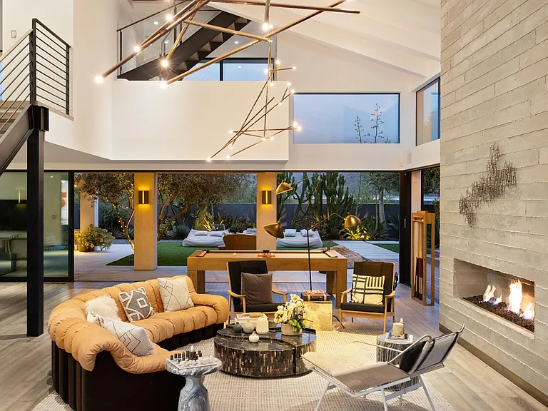 Snuggle up in front of the fireplace with a cup of hot chocolate to end the night.