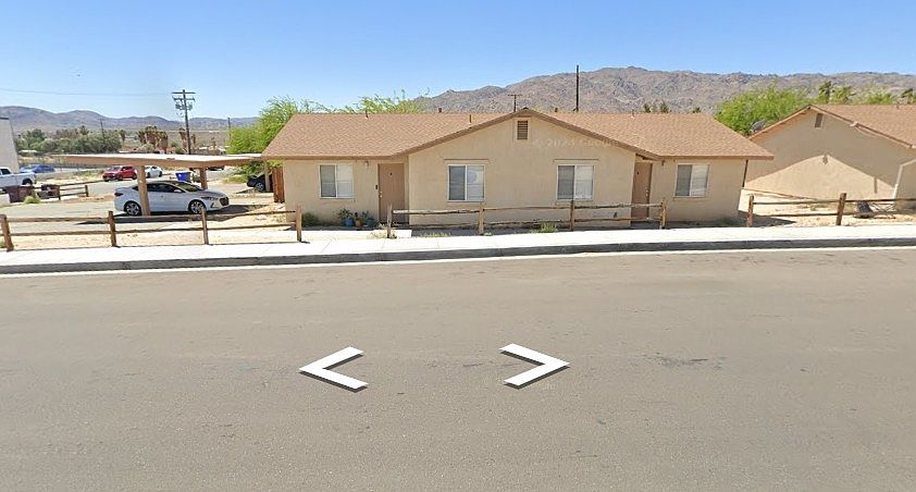 Street view entry is left door. Property is a duplex