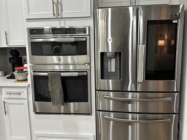 Built-in microwave and oven, plus a high-end French-door refrigerator with a wide touchscreen display
