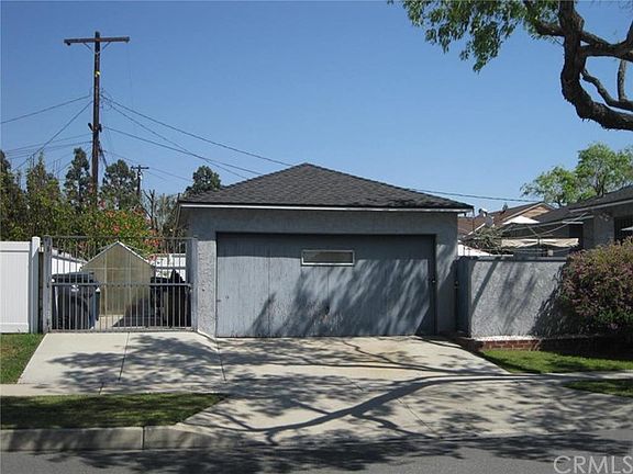 Two Car detached garage with small boat or trailer pad