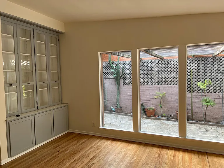Livingroom with built-ins. View of courtyard.