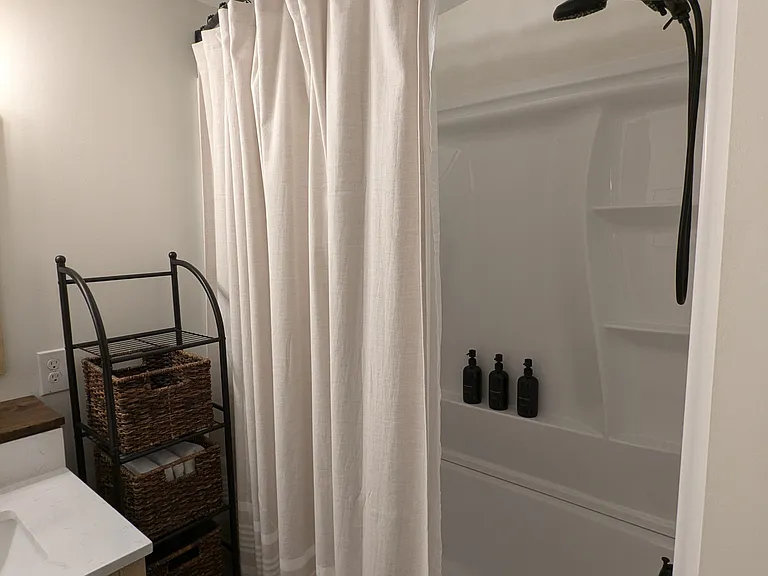 UPSTAIRS BATHROOM: Shower/Tub Combo with starter Shampoo, Conditioner, and Body Wash provided.