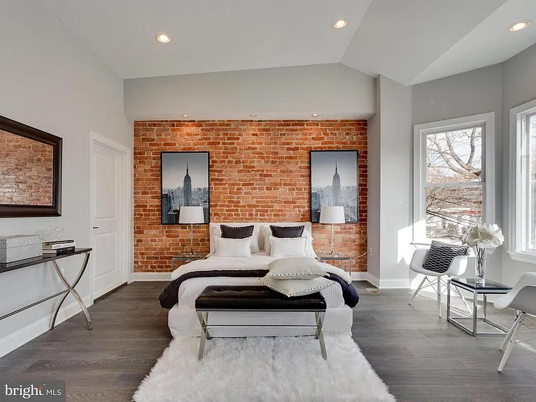 Master Bedroom: Dramatic Lighting, Exposed Brick, 10'+ Ceilings, Bay Window