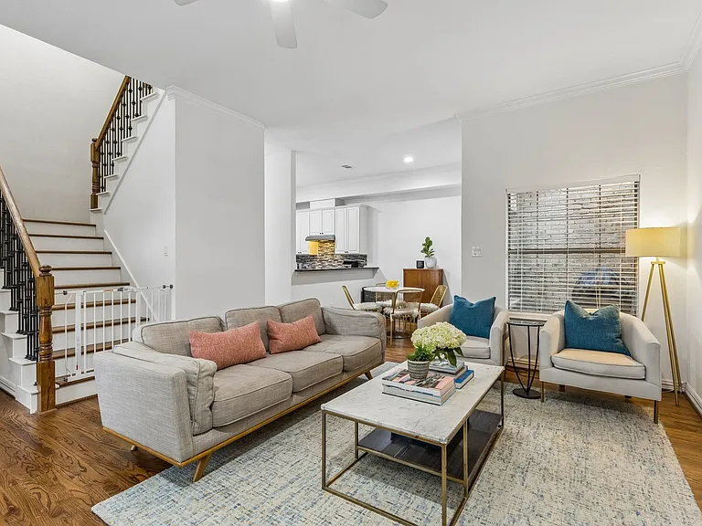 Open and spacious living area connects to the dining area and kitchen.