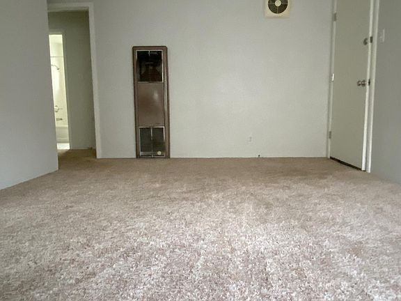 view of entry door and doorway to hall, bedroom, bath.