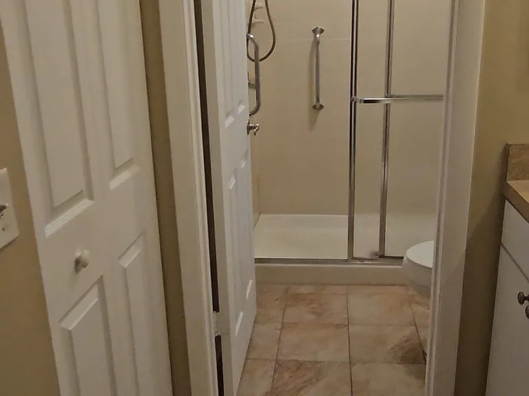 Master Bedroom Bathroom with separate vanity area and a large walk-in in closet. Privacy shower area