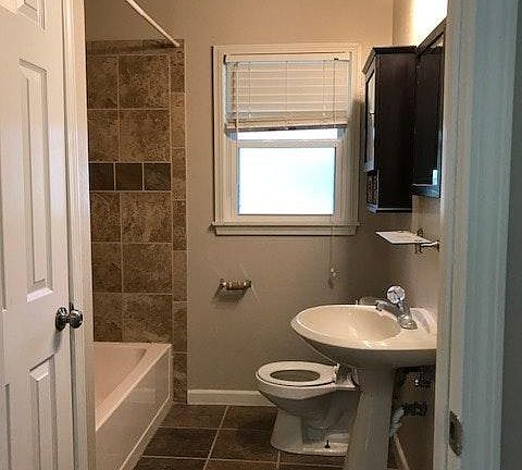 bathroom with large linen closet