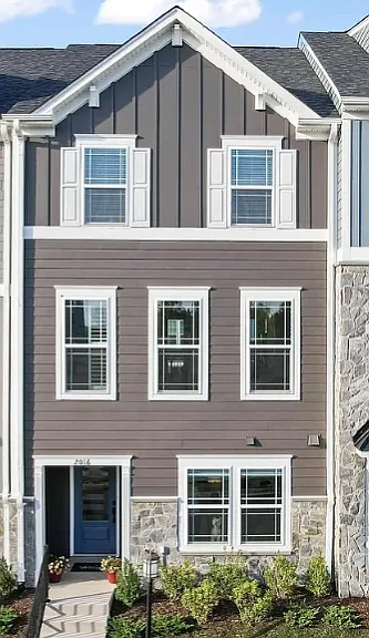 Stone and hardiboard exterior, blue front door only 2 years old.