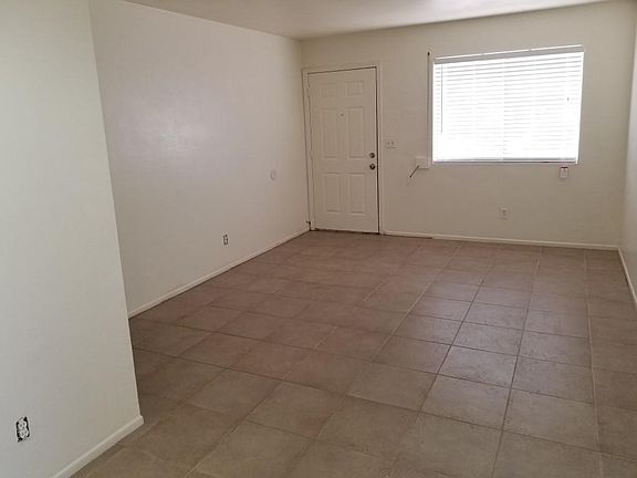 Spacious Living Room with Tile Flooring!