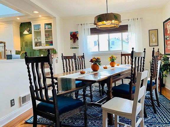 Dining room open to the living room and kitchen.