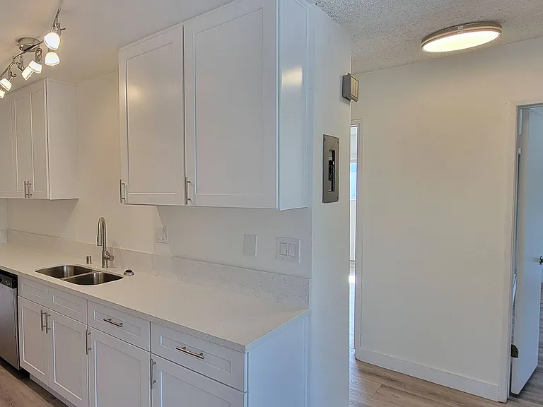 Bedroom hallway off kitchen in 2-bedroom apartment at the Haridson Apartments in Pasadena, California.