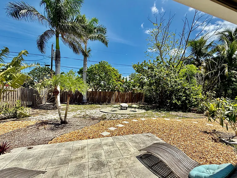 Outdoor patio view of fire pit.