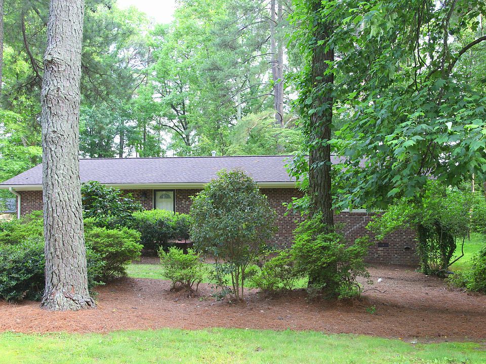 Classic Mid-Century Brick Ranch On a Wooded Lot