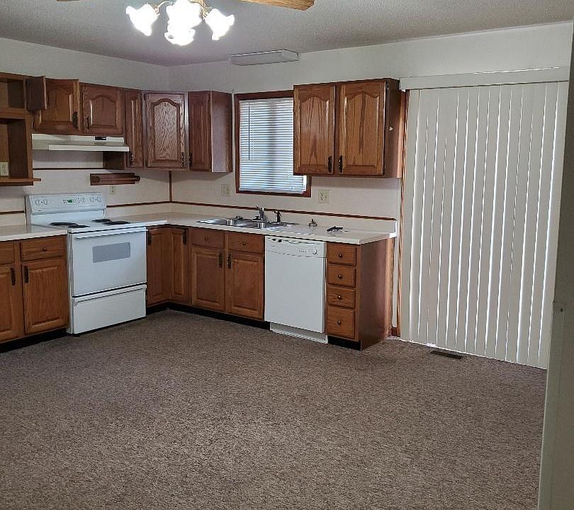 Kitchen prior to new floor and paint. Refrig included as well.