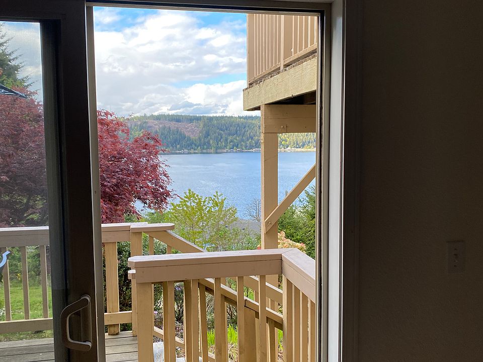 View of Hood Canal from the deck, bedroom, and living room.