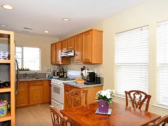 Staged kitchen, dining room, furniture not included.