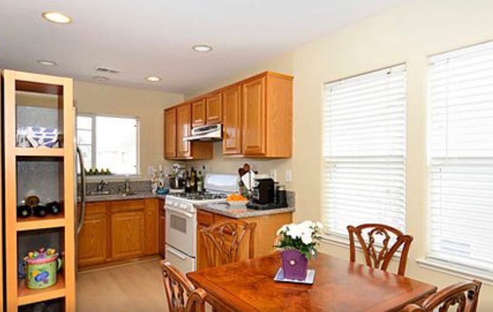 Staged kitchen, dining room, furniture not included.