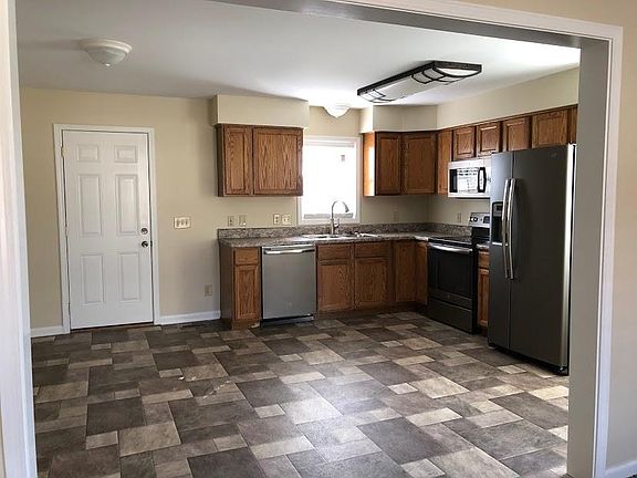 Living room view of kitchen and back door