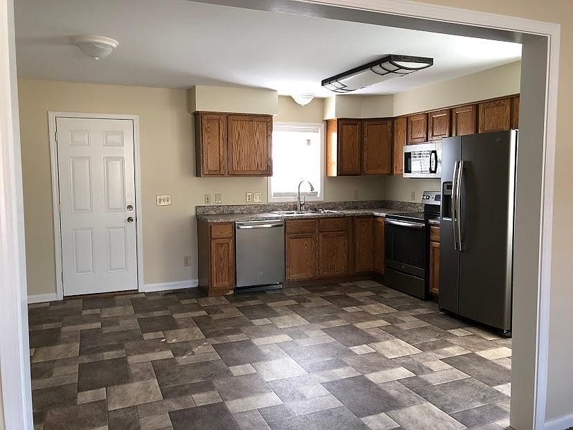 Living room view of kitchen and back door