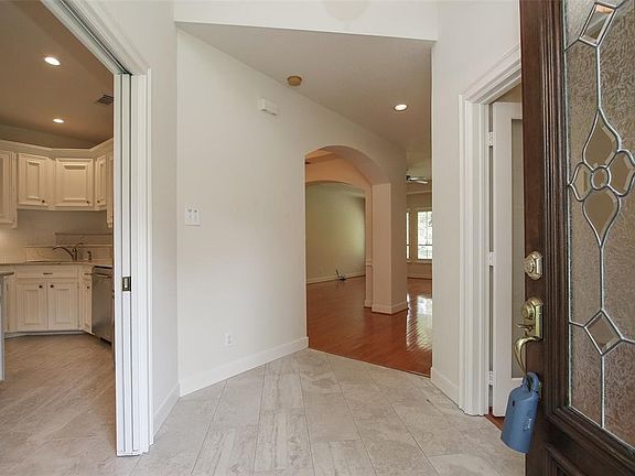 Enter the house into the foyer and look all the way to the back of the house.