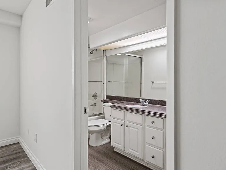 Bathroom with Bathtub and Vanity with Storage Cabinets