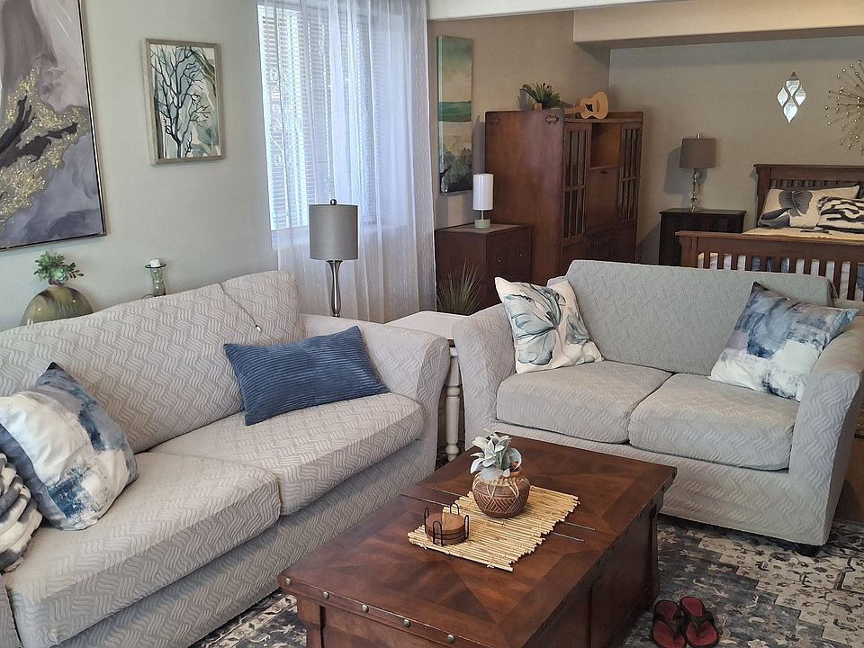 Studio living room and Bedroom area in background .
