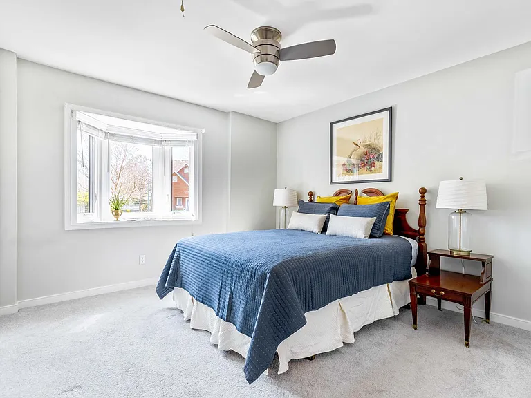 Another view of the bedroom that shows off the pretty bay window.