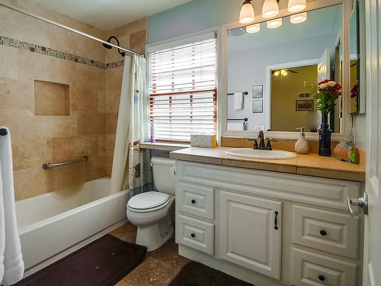 1st floor master bathroom with tub, shower, safety bar, ceiling heater for extra warmth after bath/shower