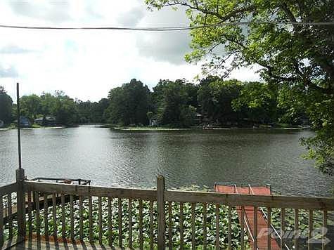 This home is just minutes from the interstate and the conveniences of shopping but feels like it's in the middle of nowhere.  Enjoy the view from your deck overlooking the 22 acre lake!  The lake does not allow gas powered boats or swimming so it's always peaceful.