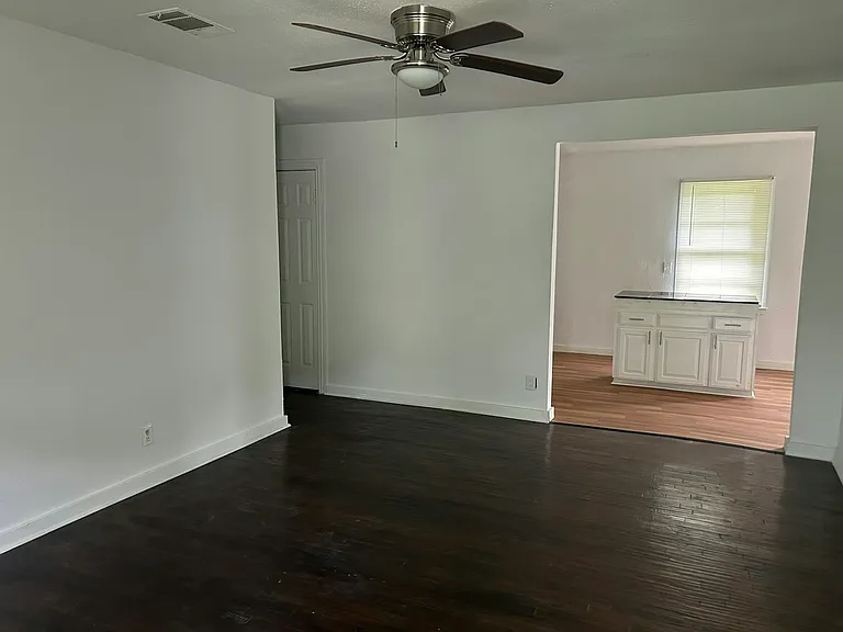 Living room view to open kitchen.