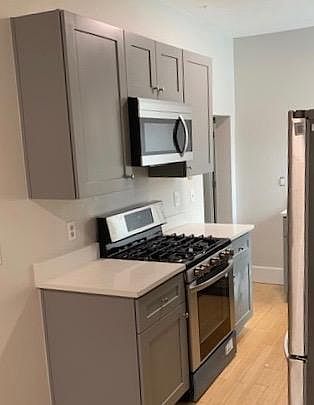 Brand new kitchen cabinets, stone tops and appliances.