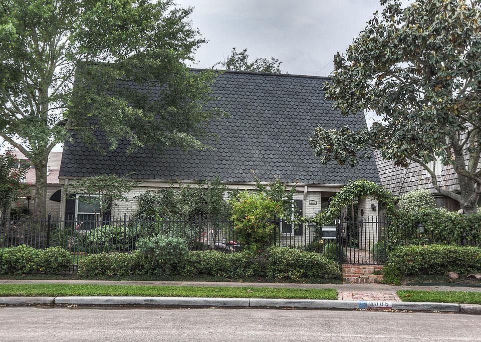 6005 Sugar Hill is not your typical area home. From the moment you drive up it is evident with the a