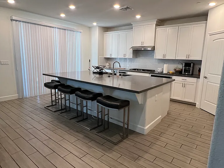Kitchen with large island and stainless steel appliances