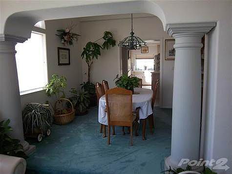 Formal dining area invites those special dinner guests to relax and enjoy.