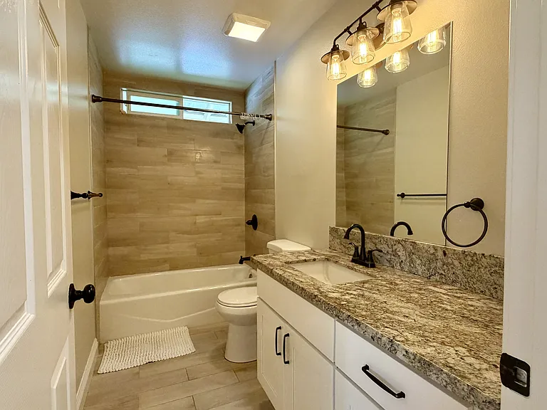 Guest bath in hallway with bathtub