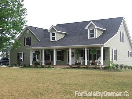 Beautiful home in the country!!
						:
						2 story, sage green siding,black shutters and white trim.