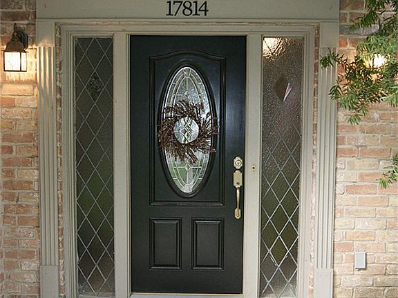 COVERED ENTRY WITH GLASS DOOR, & SIDE PANELS